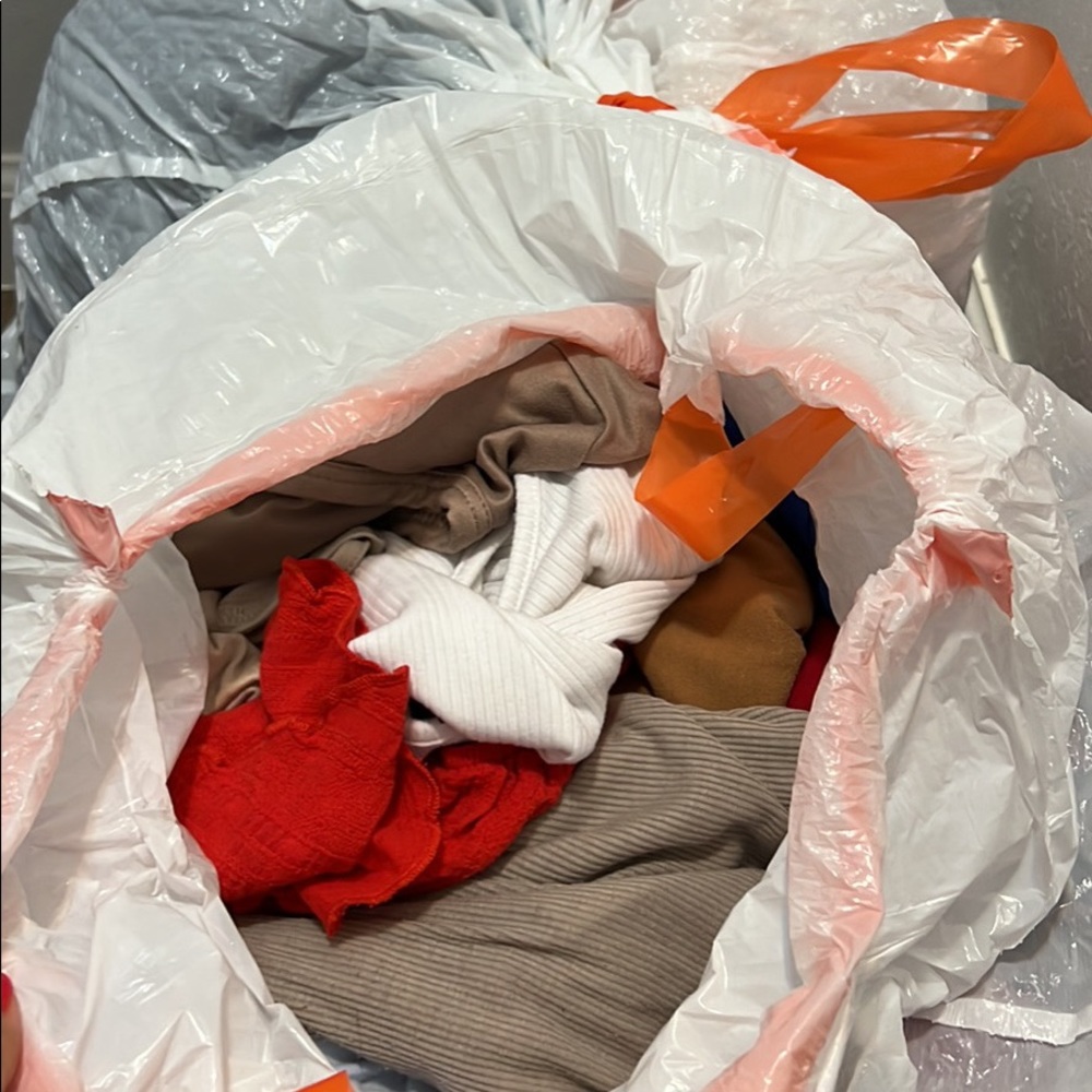 TWO BAGS OF CLOTHES. MUST GO